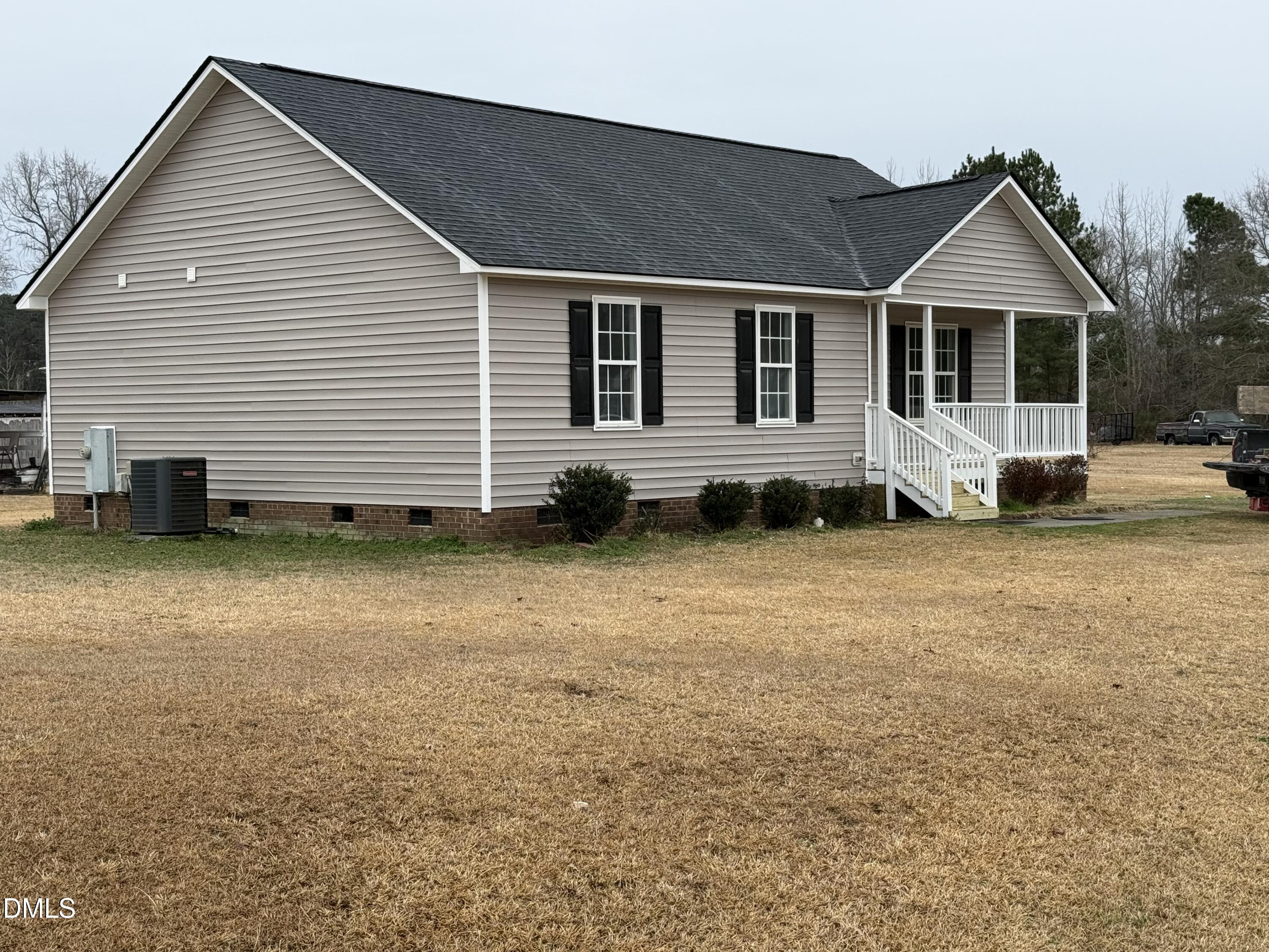 101 Copper Stone Street Smithfield, NC 27577 - Photo 4 of 32 a front view of a house with a yard