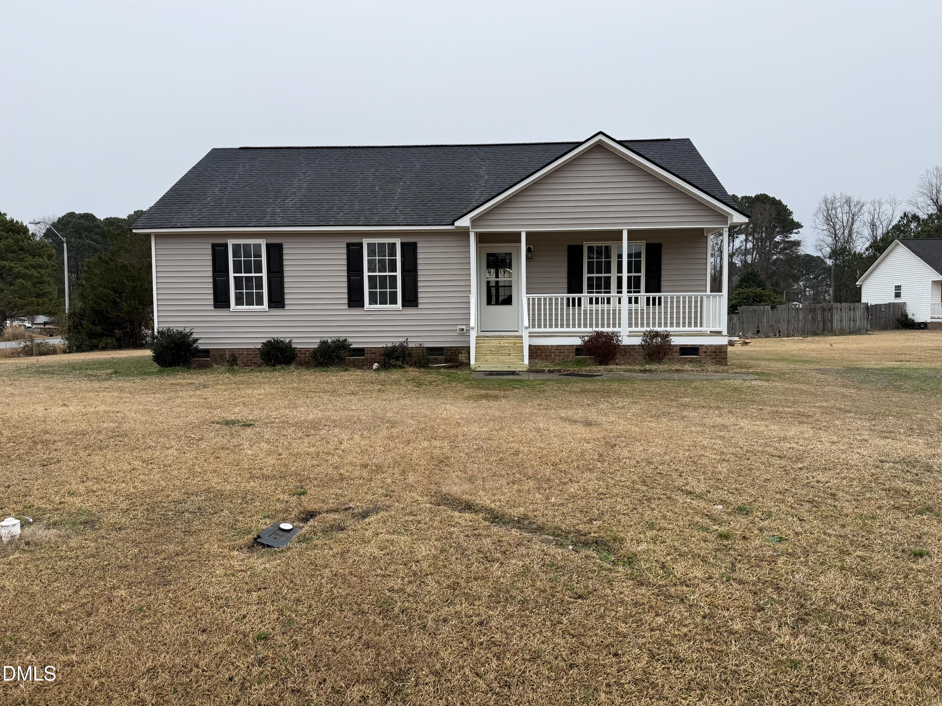 101 Copper Stone Street Smithfield, NC 27577 - Photo 6 of 32 a front view of a house with a garden