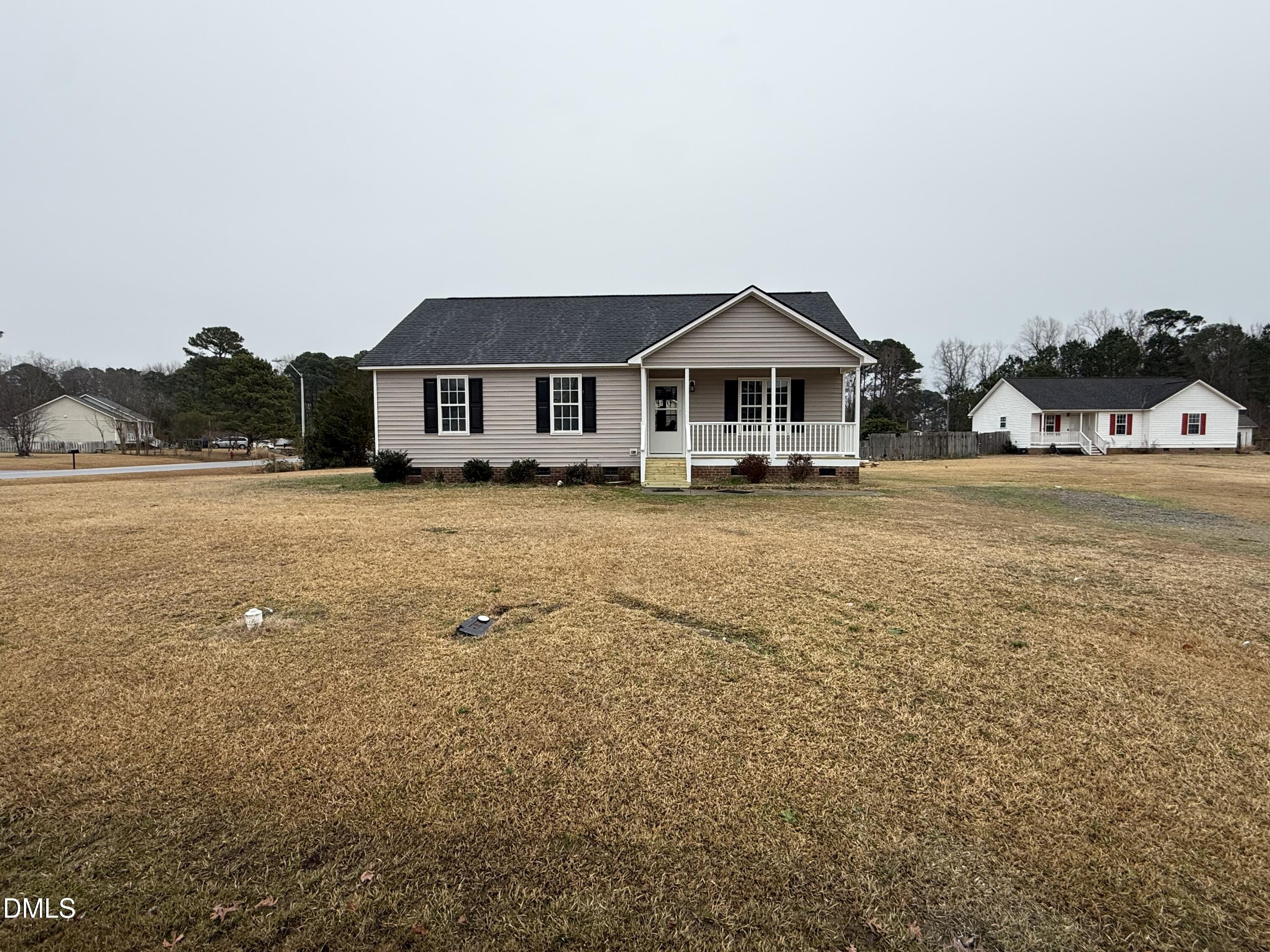 101 Copper Stone Street Smithfield, NC 27577 - Photo 8 of 32 a front view of a house with a yard