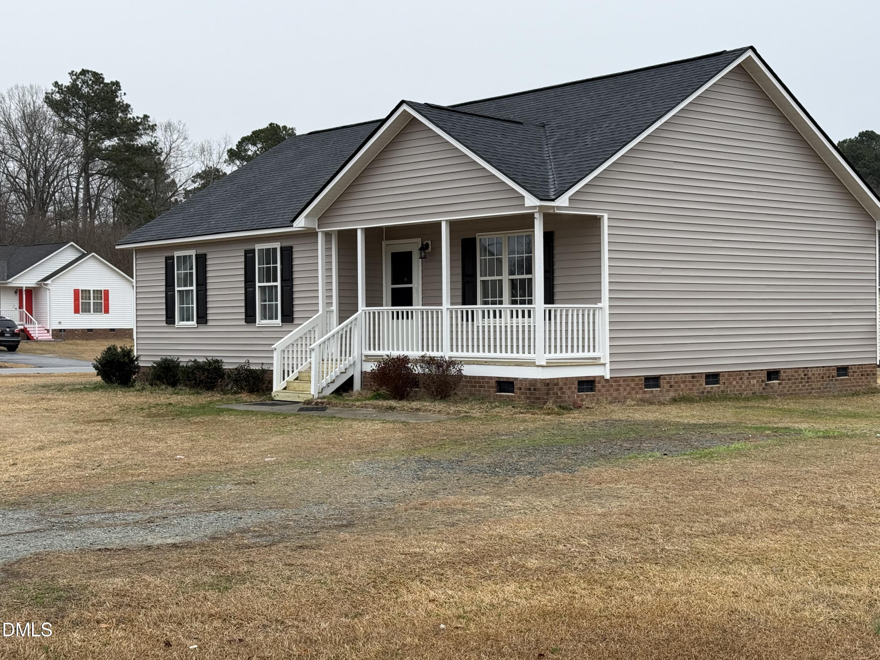 101 Copper Stone Street Smithfield, NC 27577 - Photo 9 of 32 a front view of a house with a yard