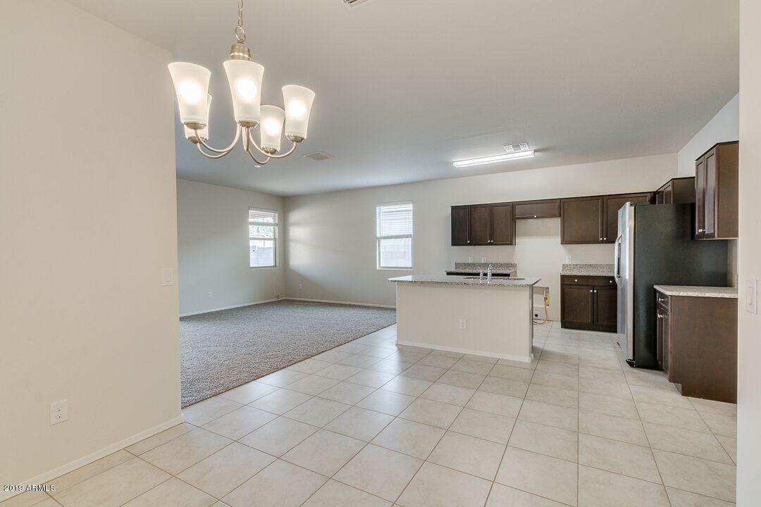 31061 West Picadilly Road Buckeye, AZ 85396 - Photo 9 of 31 diningkitchenandliving