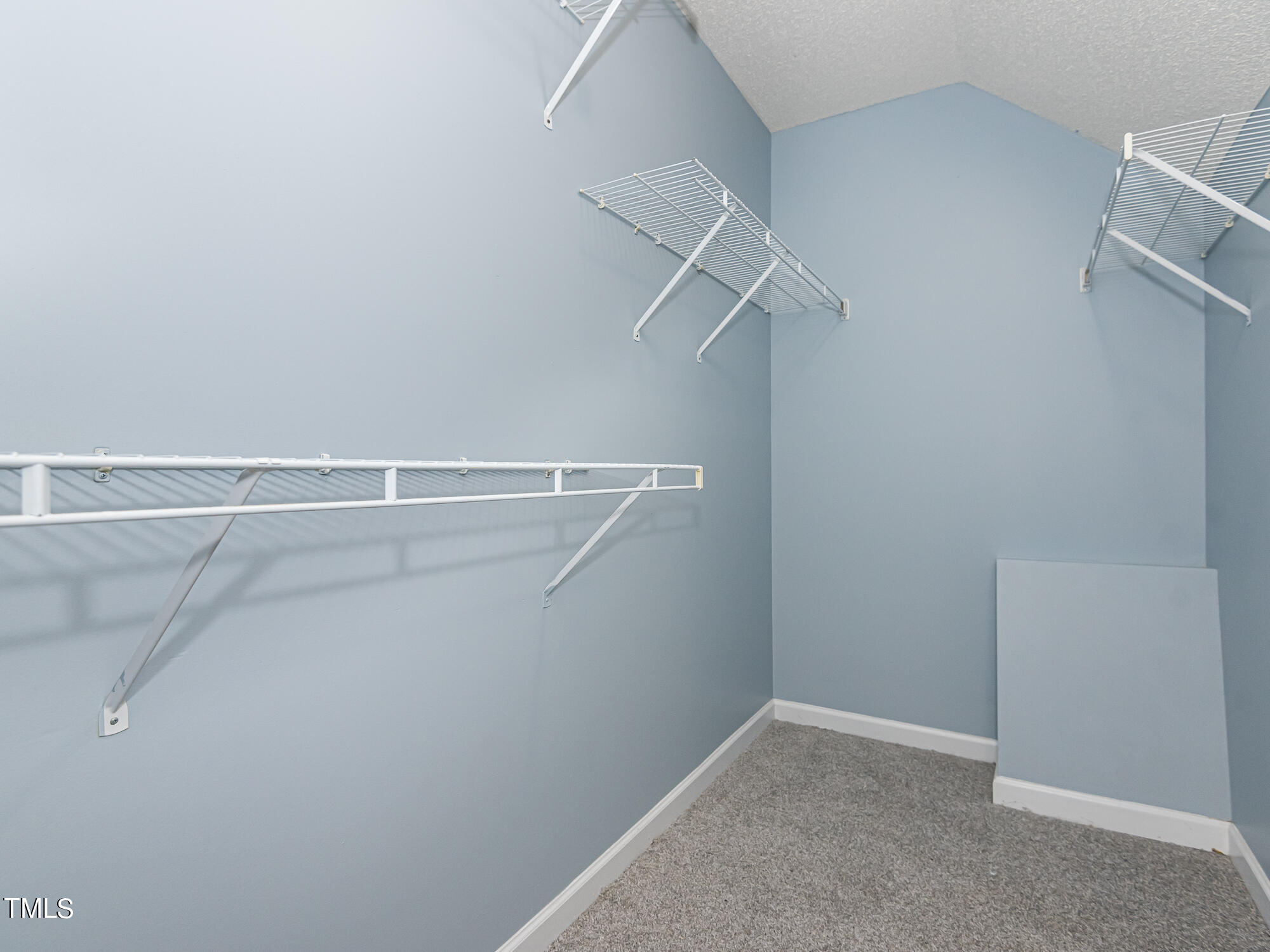 33 Troy Drive Clayton, NC 27520 - Photo 12 of 37 a view of a room with racks on the wall