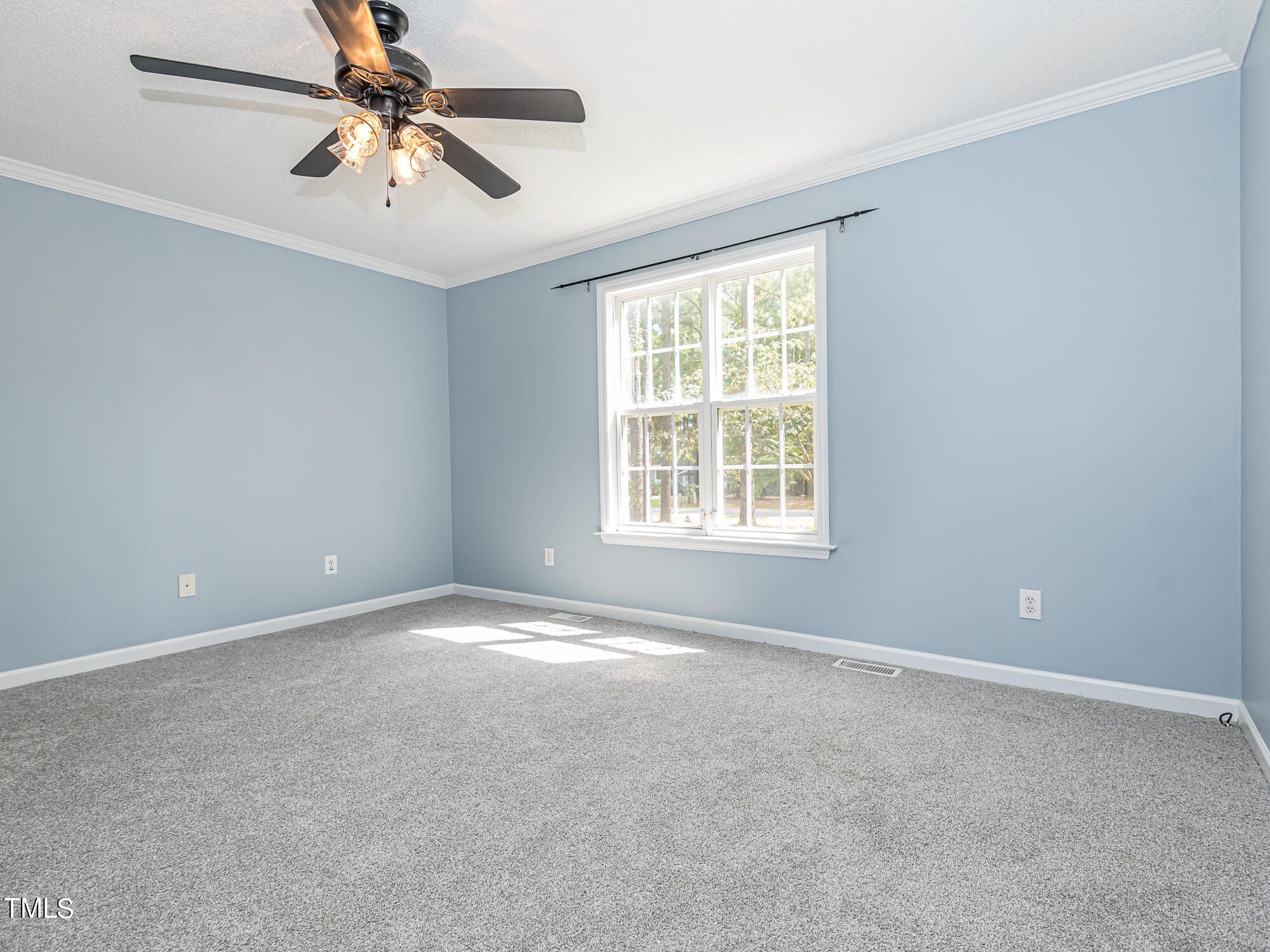 33 Troy Drive Clayton, NC 27520 - Photo 14 of 37 an empty room with windows and fan