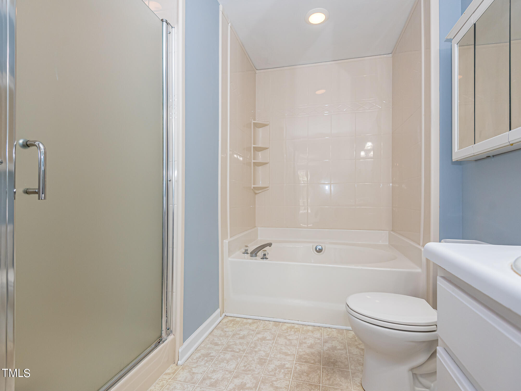33 Troy Drive Clayton, NC 27520 - Photo 17 of 37 a bathroom with a toilet and a bath tub