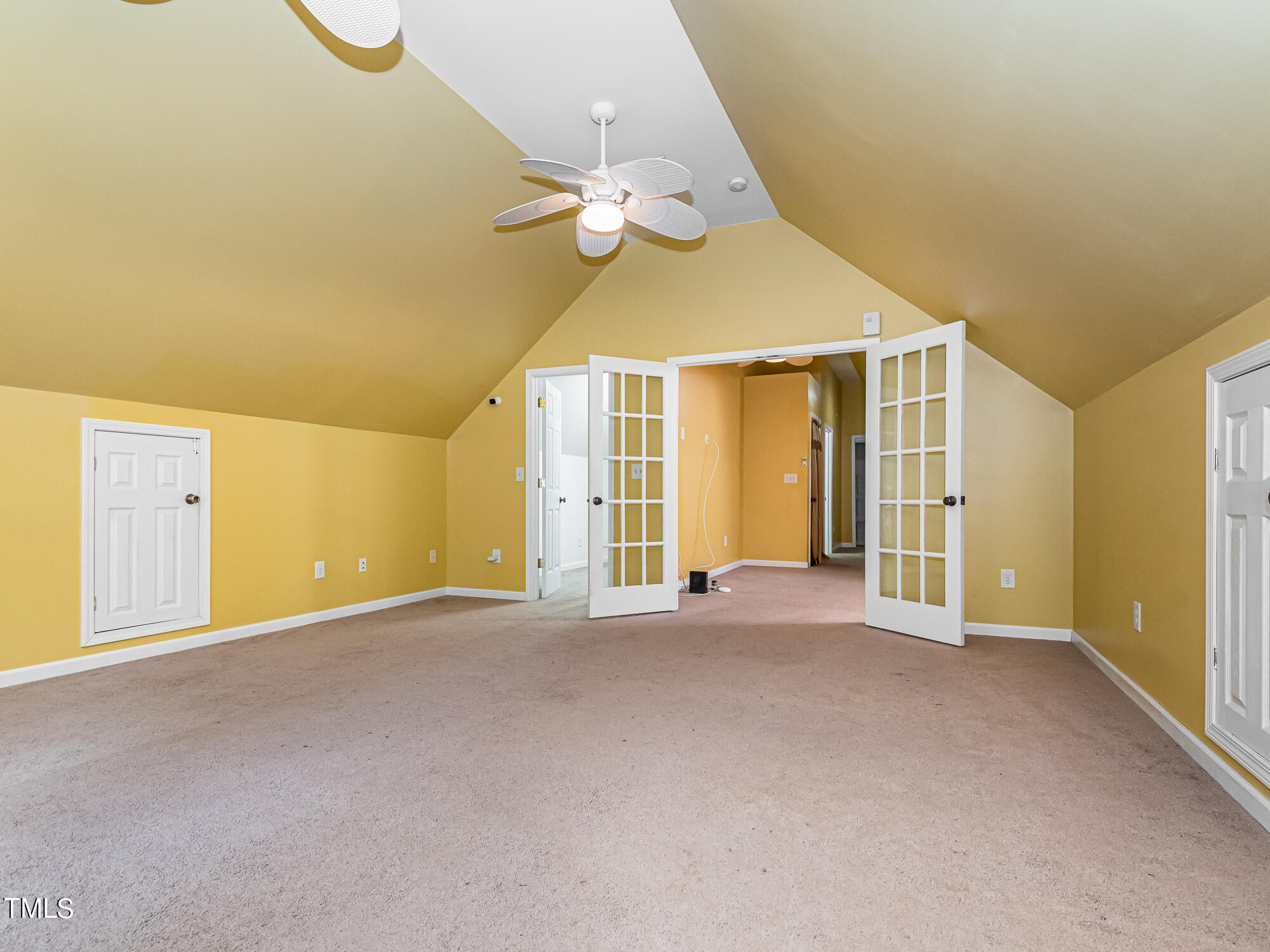 33 Troy Drive Clayton, NC 27520 - Photo 22 of 37 a view of a big room with windows and chandelier fan