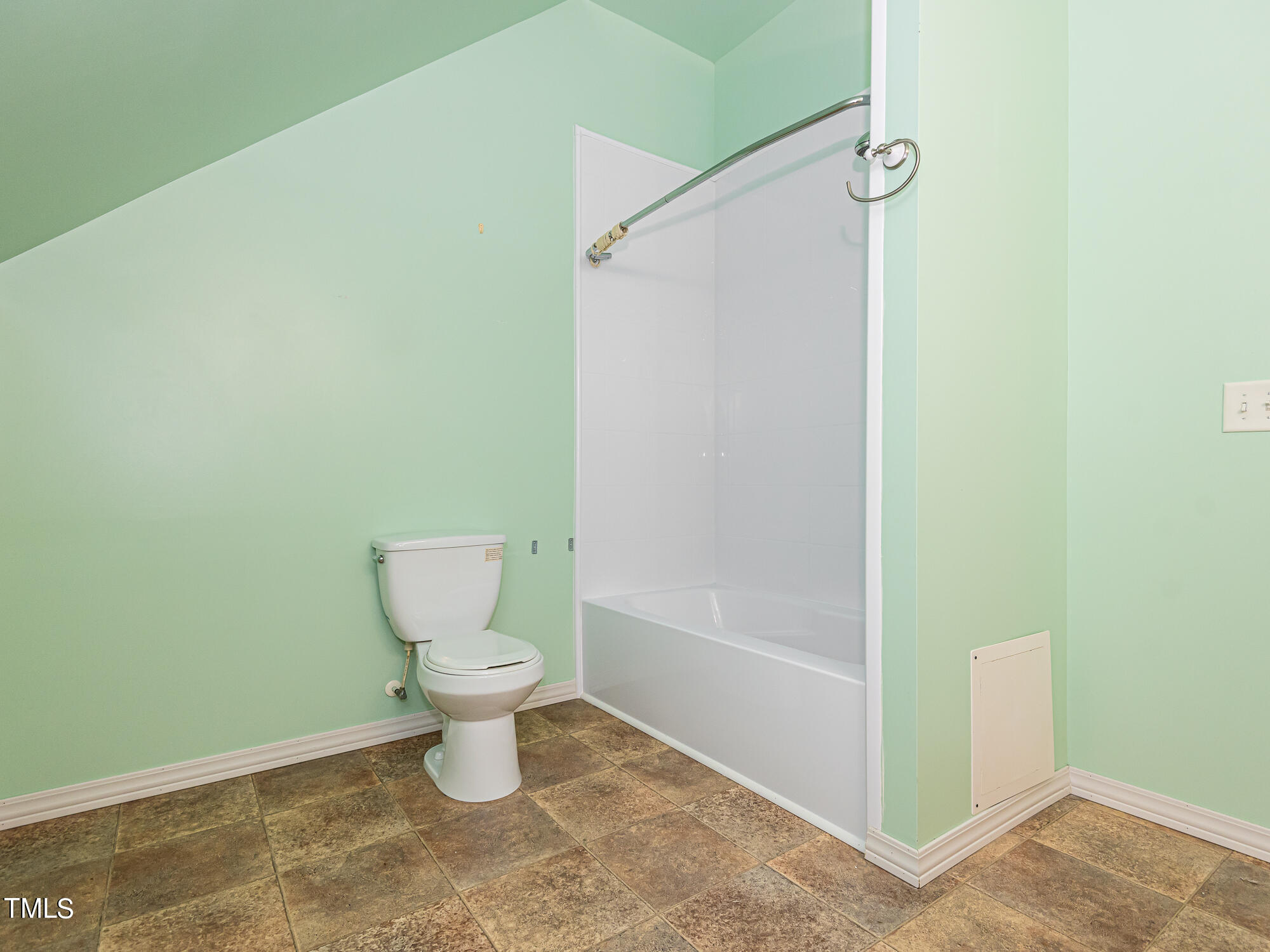 33 Troy Drive Clayton, NC 27520 - Photo 27 of 37 a bathroom with a toilet and a shower