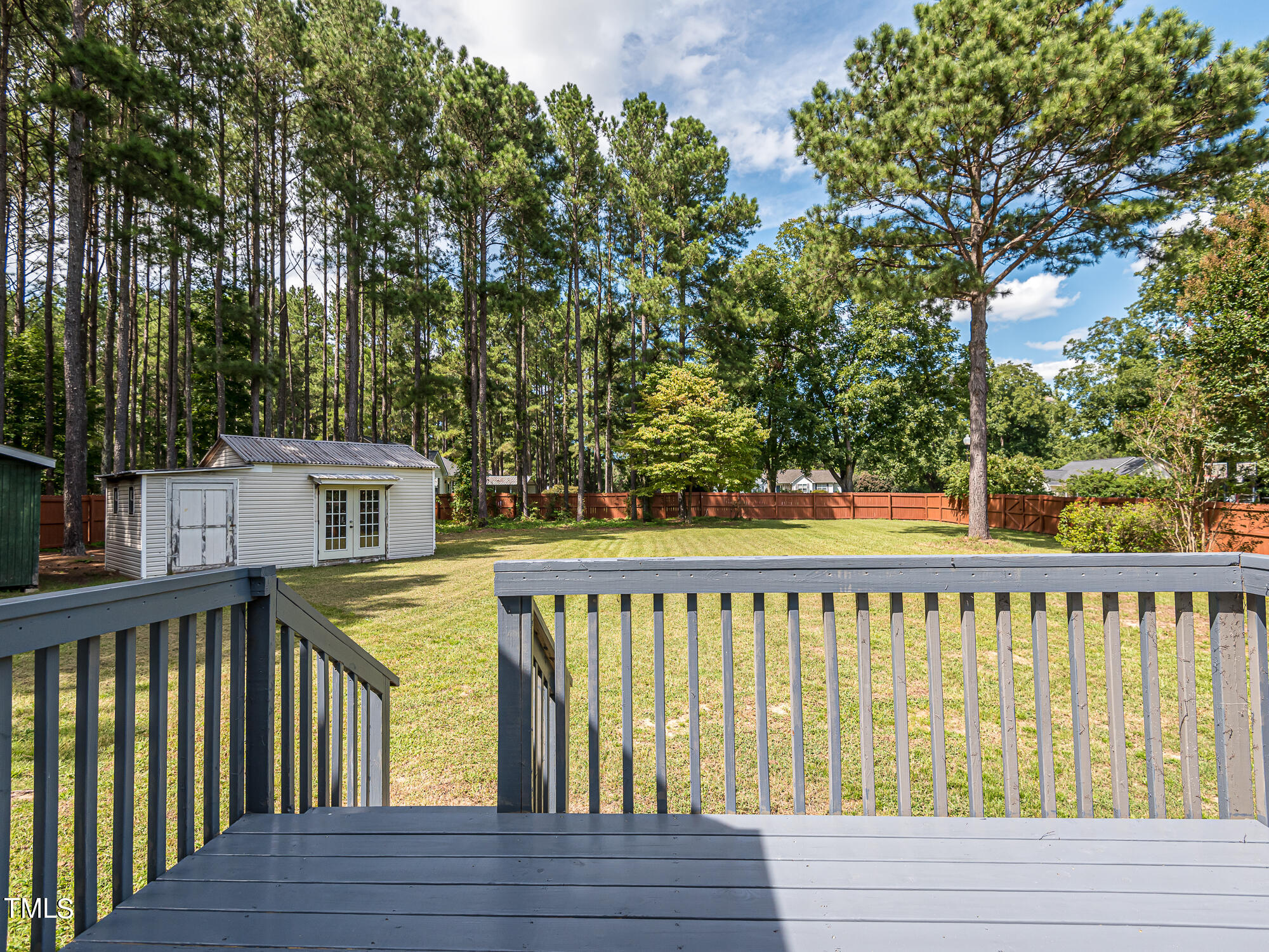 33 Troy Drive Clayton, NC 27520 - Photo 29 of 37 a view of a wooden deck and trees