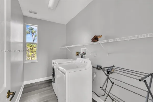 a utility room with dryer and washer