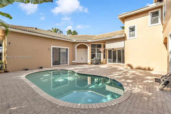 a view of a house with swimming pool