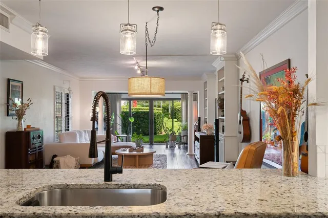 a living room with furniture fireplace and a large window