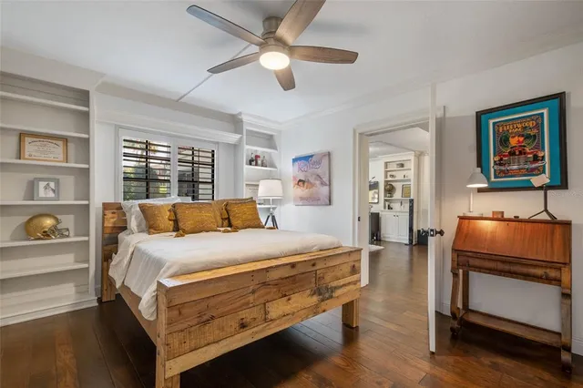 a bed room with a bed and a window