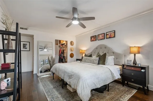 a bathroom with a granite countertop toilet sink and mirror