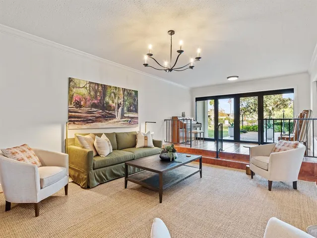 an aerial view of a house a yard and outdoor seating