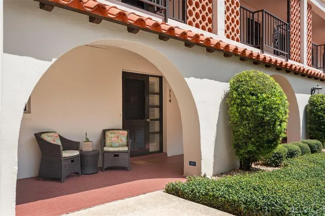 a view of a hallway with wooden floor and stairs