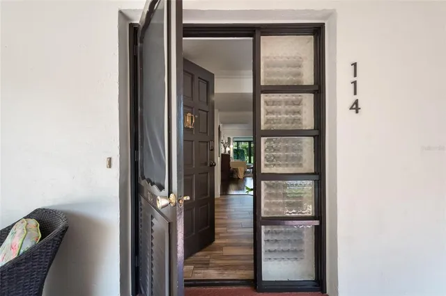 a view of living room with furniture and wooden floor