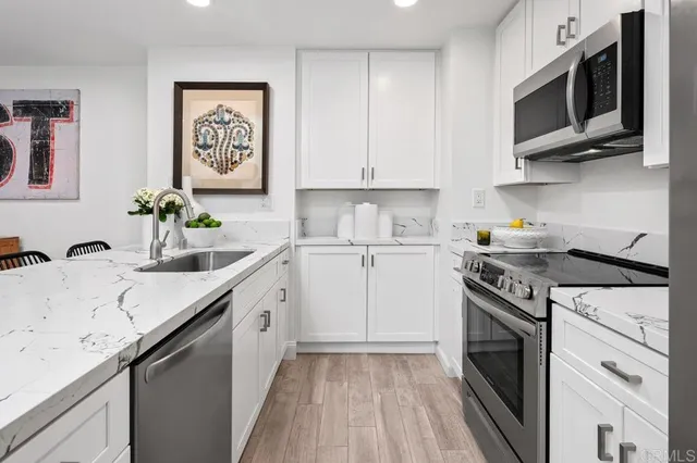 a spacious bathroom with a sink double vanity and a shower