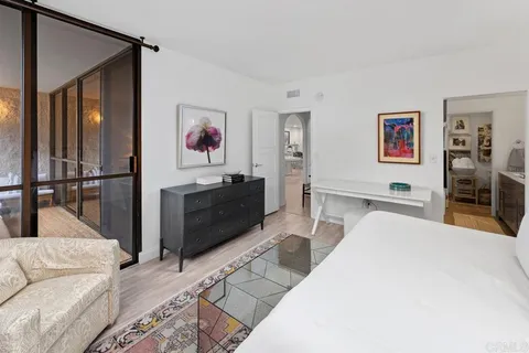 a bedroom with furniture and a couch