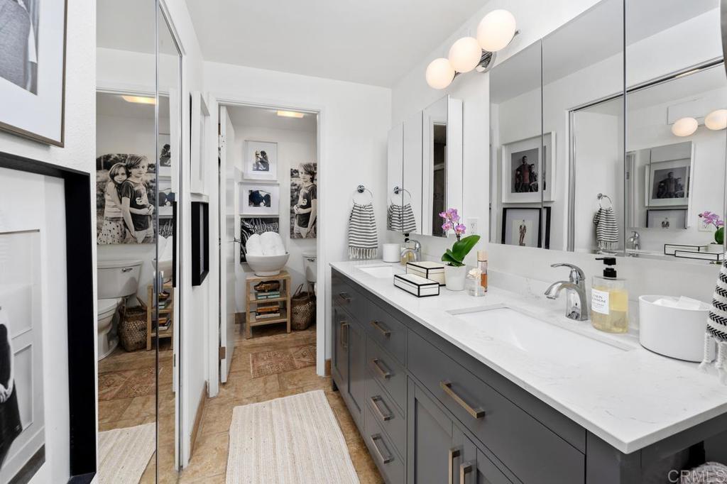 2500 Torrey Pines Road, Unit 201 La Jolla, CA 92037 - Photo 19 of 42 a spacious bathroom with a sink double vanity and a shower