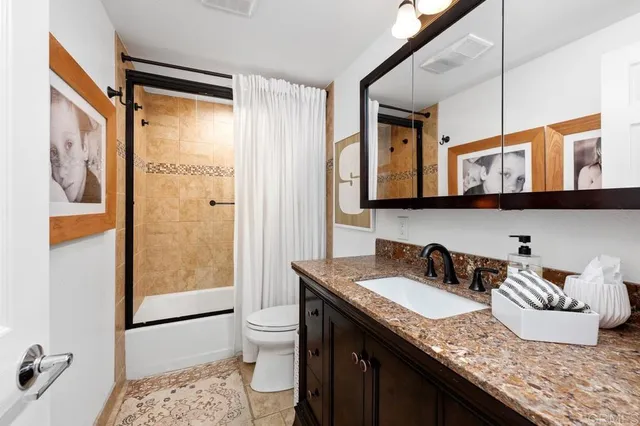 a view of garage with a car parked in it