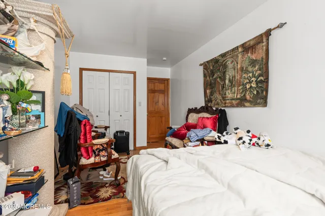 a bed room with a bed and a plant