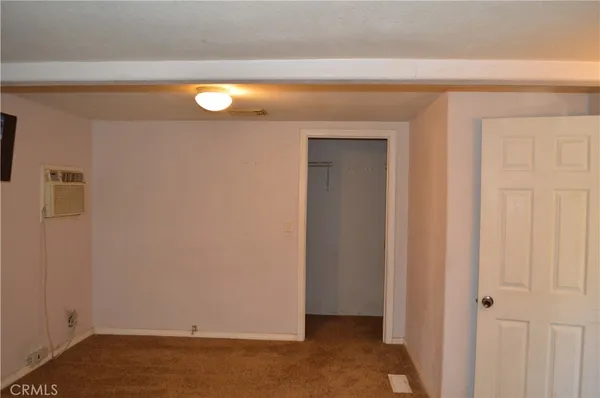 a view of a livingroom with wooden floor