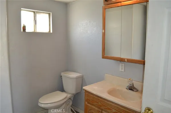 a view of a room with floor to ceiling window and stairs