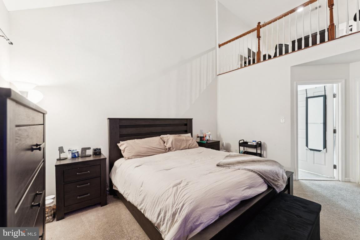 2608 St Marys View Road Accokeek, MD 20607 - Photo 13 of 25 a bedroom with a bed and wooden floor