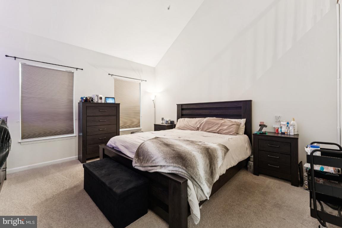 2608 St Marys View Road Accokeek, MD 20607 - Photo 13 of 26 a bedroom with a bed and dresser with mirror