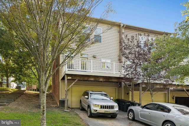 a car parked in front of a house