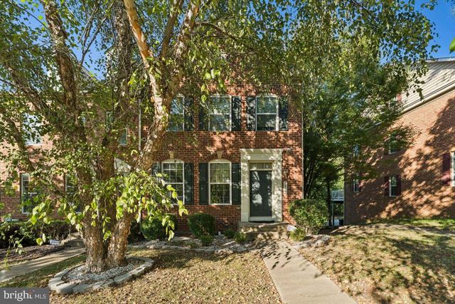 a view of a house with a tree