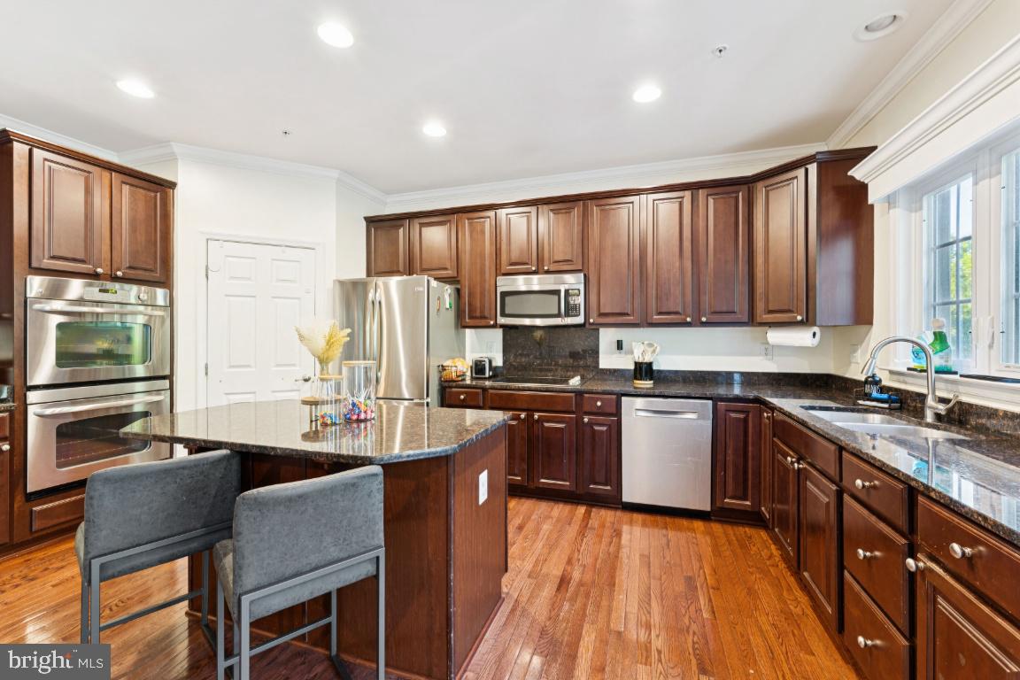 2608 St Marys View Road Accokeek, MD 20607 - Photo 7 of 25 a kitchen with stainless steel appliances granite countertop sink stove top oven and cabinets