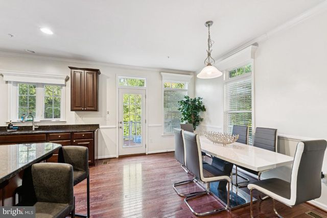 a dining room with furniture window wooden floor