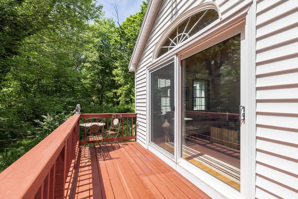 21 Vanderbelt Road Acton, MA 01720 - Photo 32 of 36 a view of balcony with wooden floor and fence