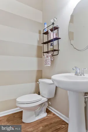 a kitchen with stainless steel appliances granite countertop a stove top oven a sink and a refrigerator