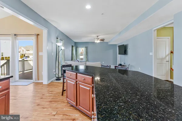 a view of a dining room with furniture wooden floor and chandelier