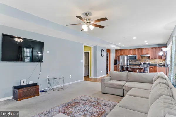 a spacious bedroom with a bed and a chandelier