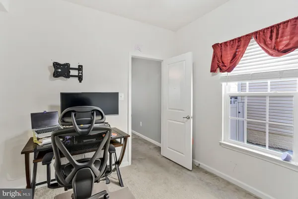 a bathroom with a shower and a glass door