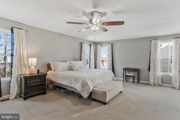 a bathroom with a glass shower door and a bathtub