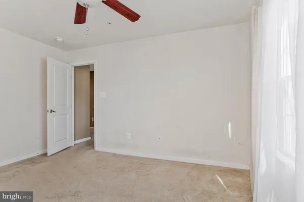 a view of a roof deck with table and chairs