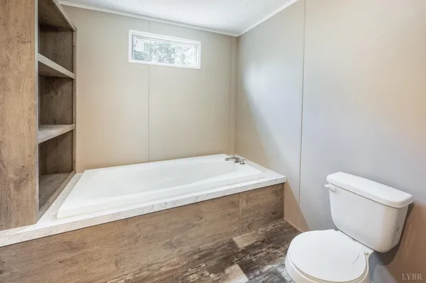 a white toilet sitting next to a bathroom sink