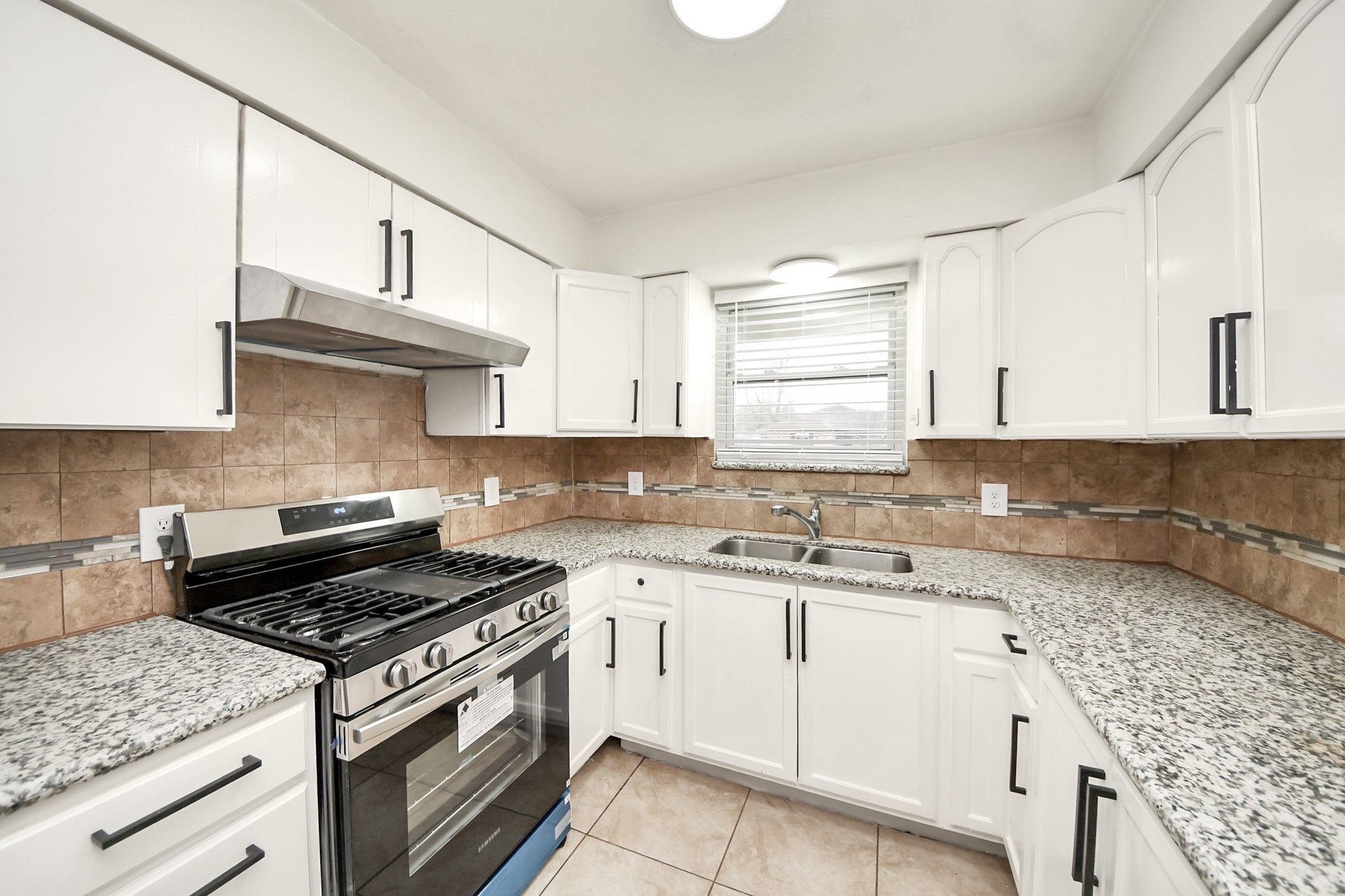 1139 Hartwick Road Houston, TX 77037 - Photo 22 of 38 a kitchen with stainless steel appliances granite countertop a sink stove and cabinets