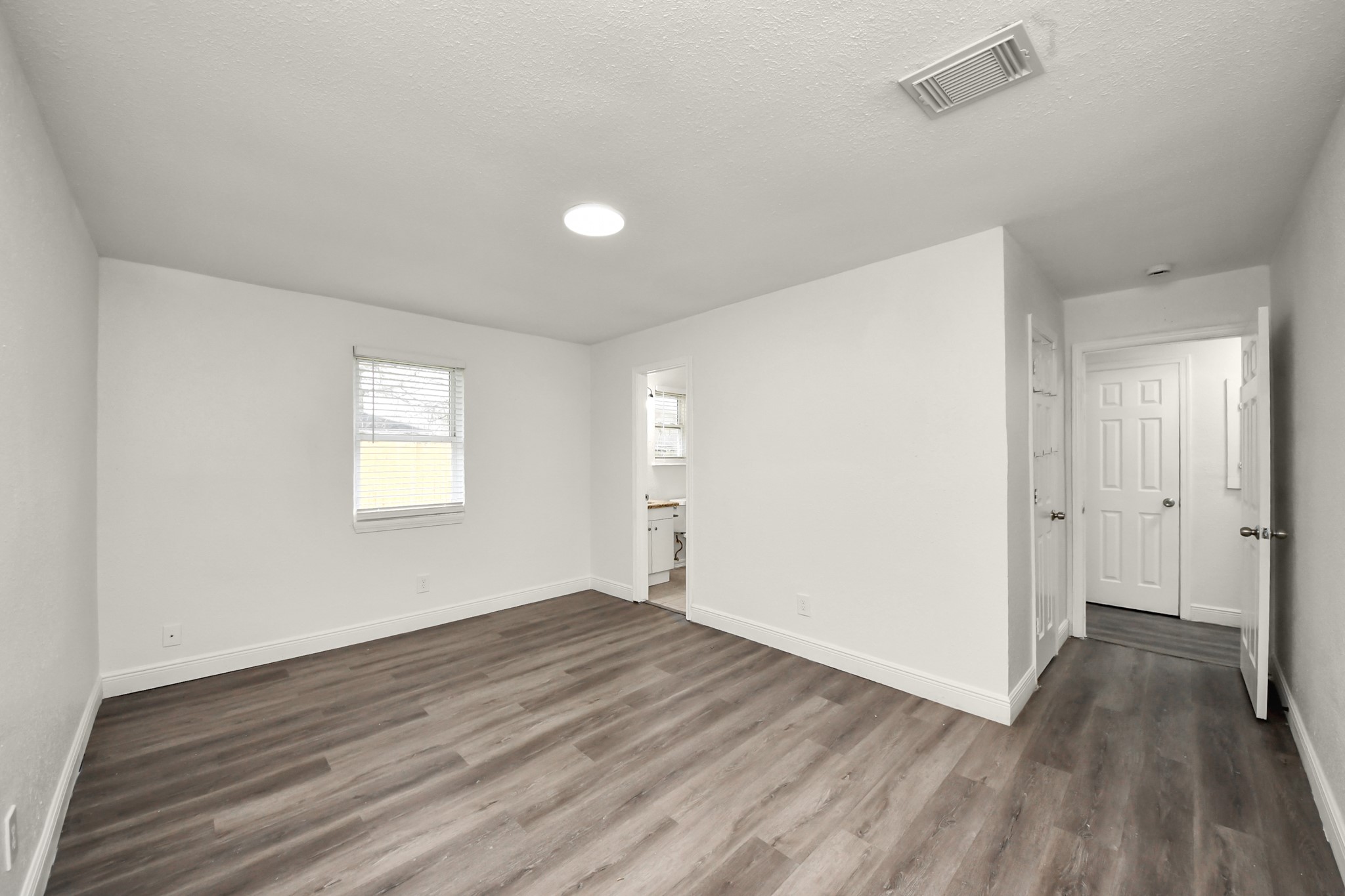 1139 Hartwick Road Houston, TX 77037 - Photo 34 of 38 a view of a room with wooden floor and window
