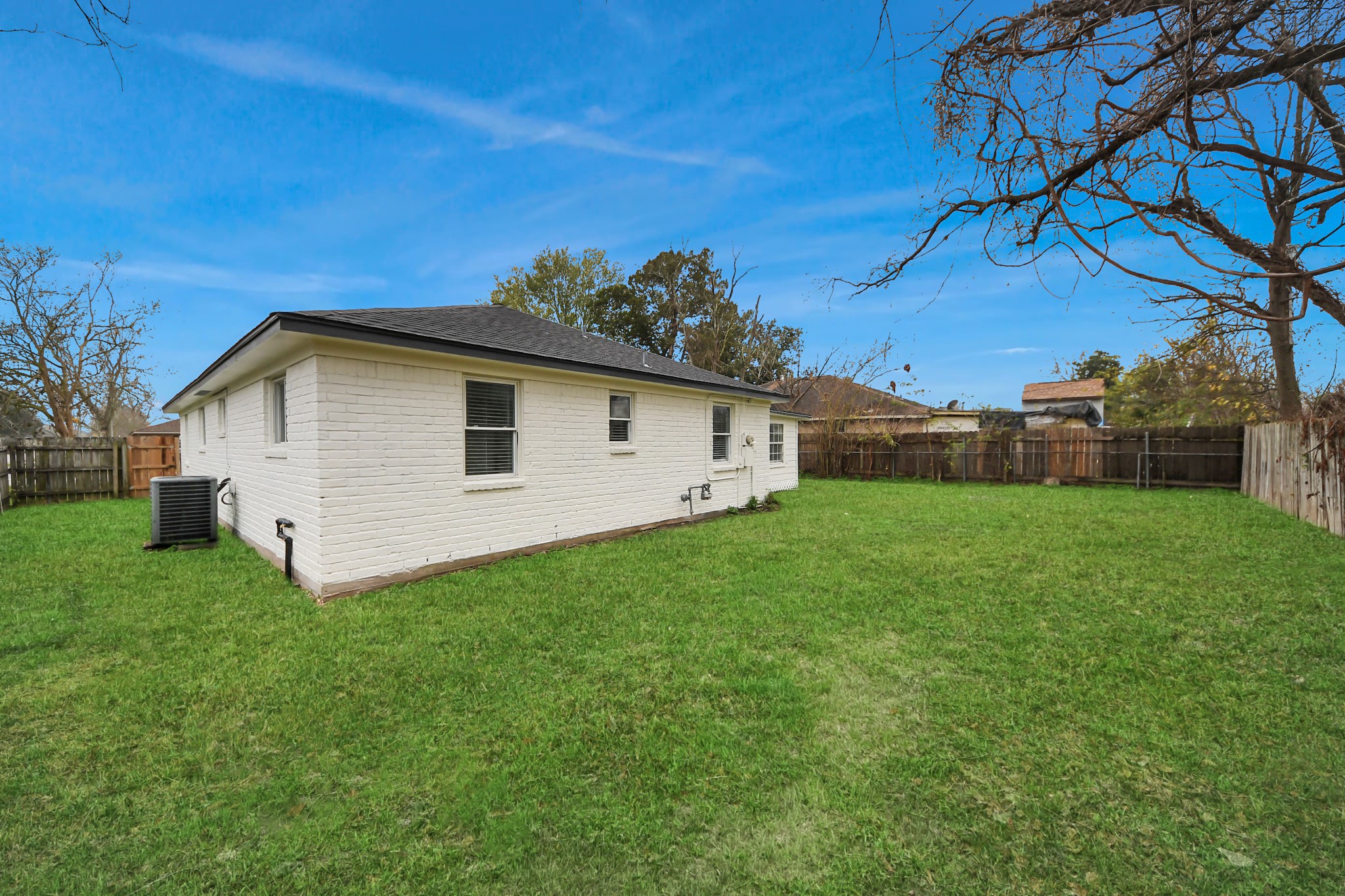 1139 Hartwick Road Houston, TX 77037 - Photo 5 of 38 a view of a backyard with plants and large trees
