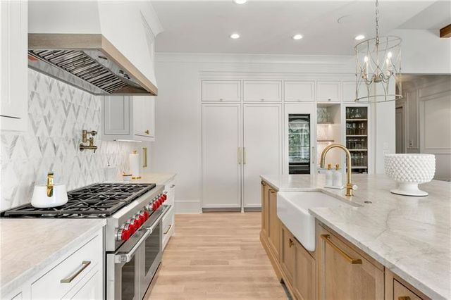 a spacious bedroom with a bed and a cabinets