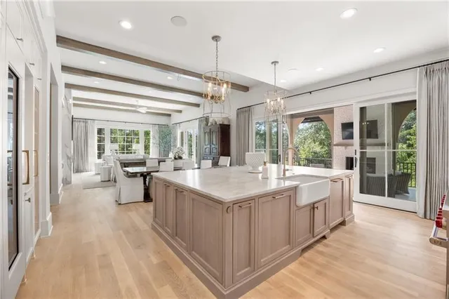 a spacious bathroom with a sink a mirror and a shower