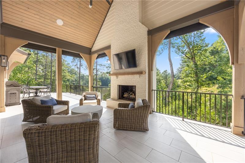 3940 Cottage Park Alpharetta, GA 30004 - Photo 30 of 76 a living room with furniture and a fireplace