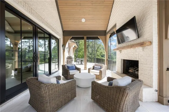 a bathroom with a toilet a sink a glass door a shower a mirror and vanity