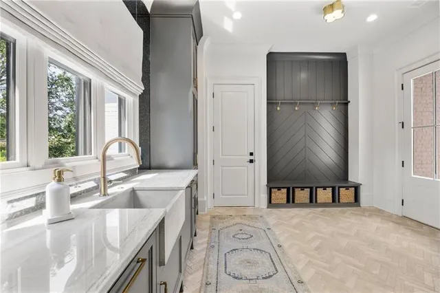 a living room with furniture a ceiling fan and a rug