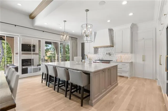 a spacious bedroom with a bed and a large window