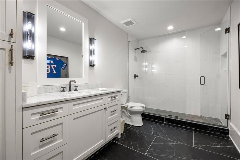 3940 Cottage Park Alpharetta, GA 30004 - Photo 66 of 76 a bathroom with a toilet sink and mirror